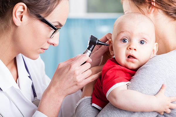 image of a baby having a check up